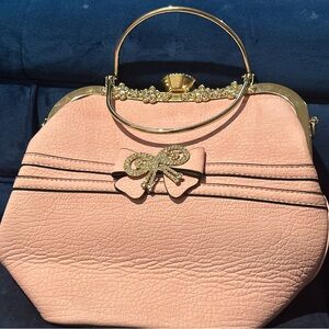 Elegant Pink Handbag with Gold Accents